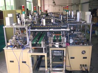 Fully automatic assembly and test of heating strips for automotive airconditioning